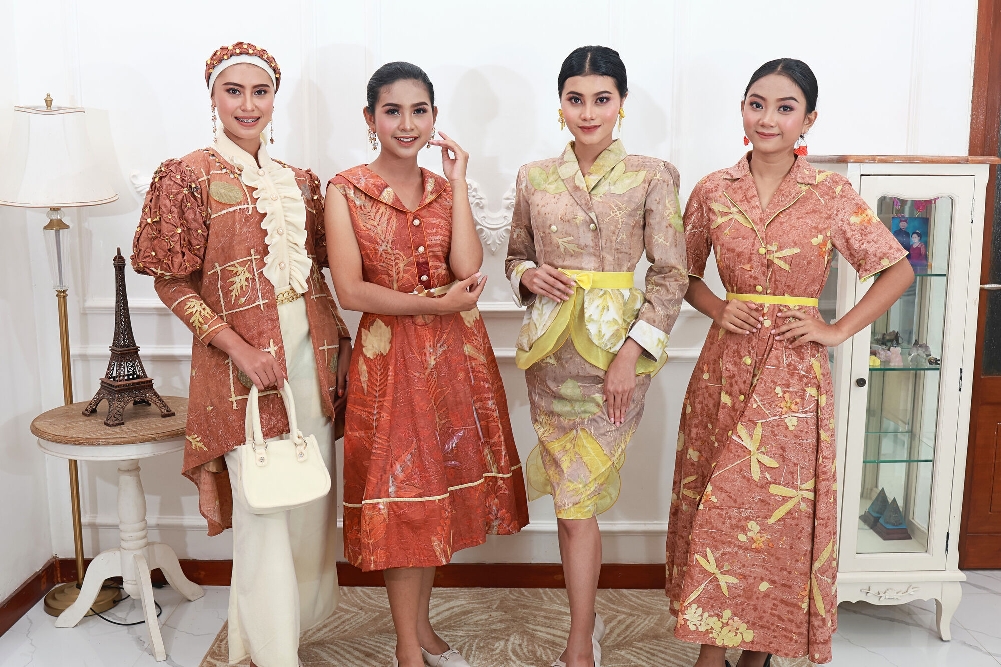 Four models in terracotta and gold eco-print looks